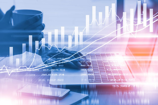 Illustration of various technological items, including graphs, numbers and a laptop
